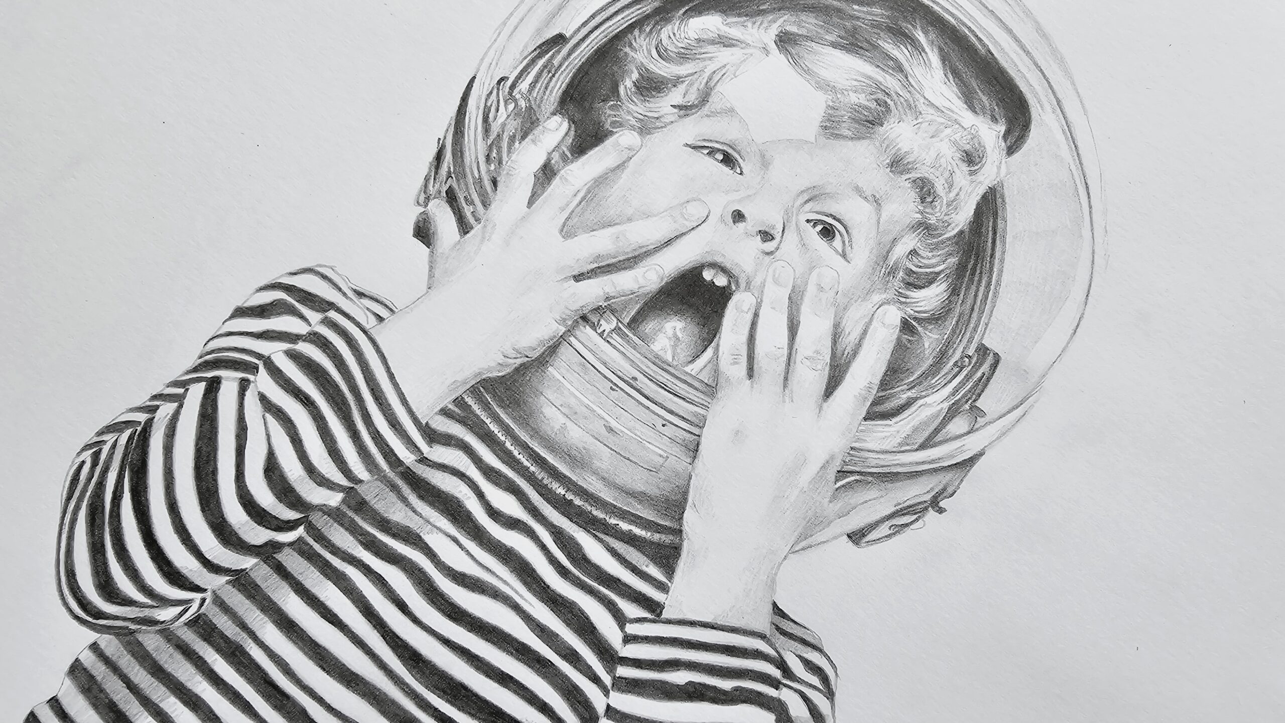 Boy dreaming big with a astronaut helmet on, drawing